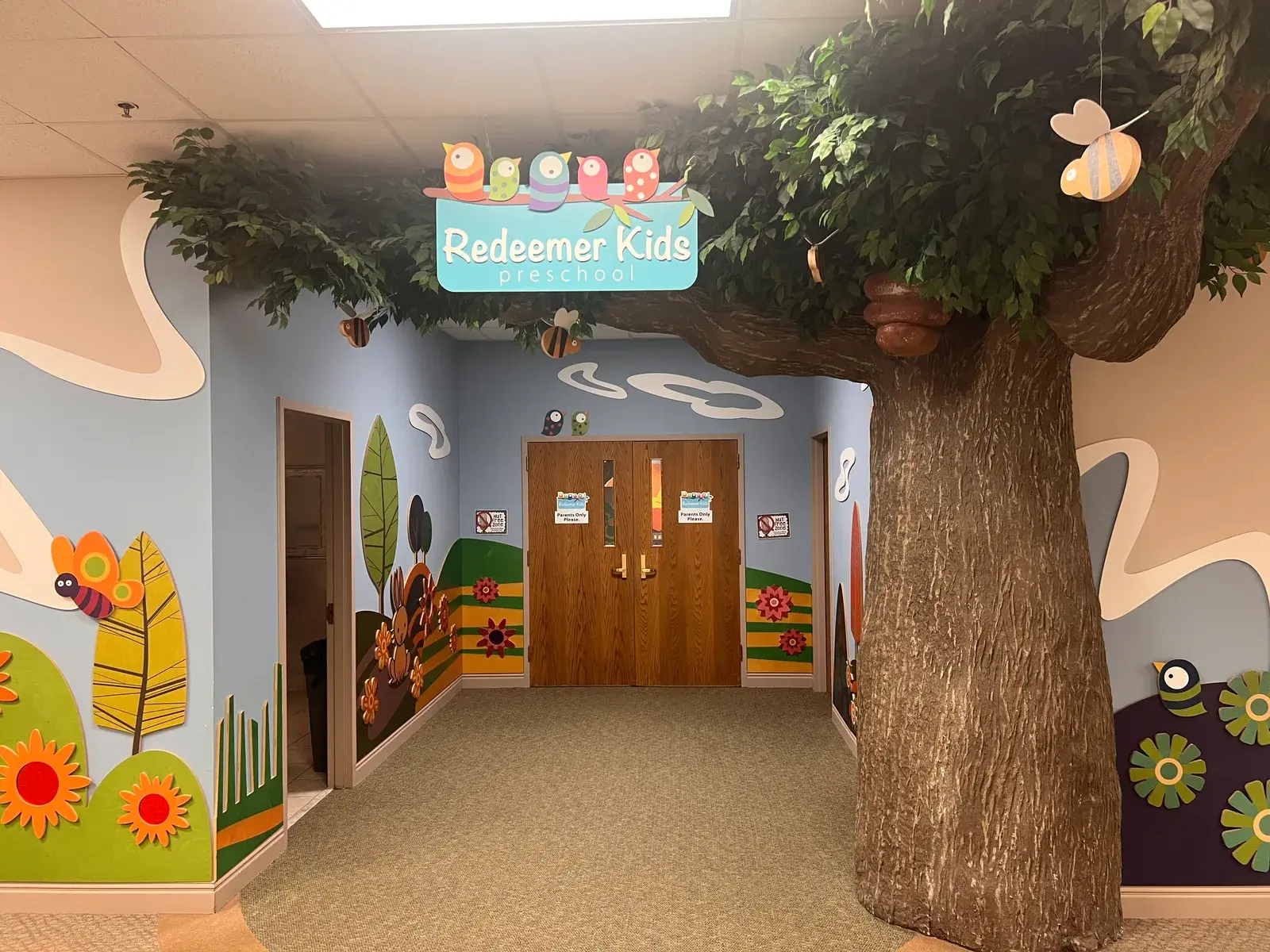 Church children's ministry entrance with colorful murals — churches with youth programs need abuse and molestation coverage