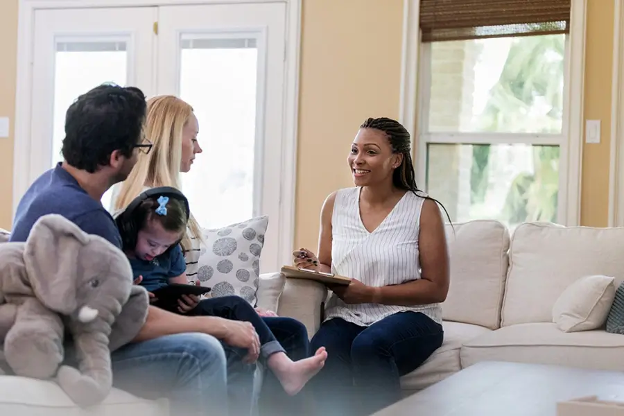 social worker with foster family and child