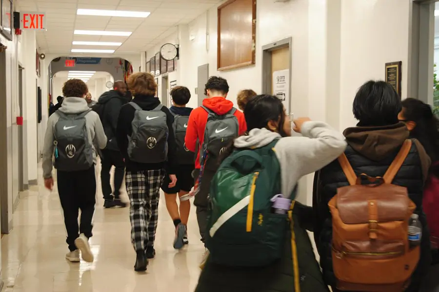 students in a school hallway between classes