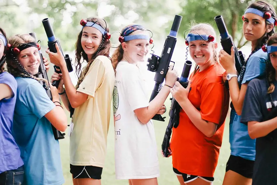 Camp All American Campers having fun with paintball