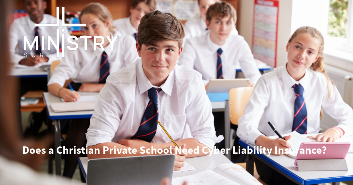 Group of high school students in uniforms sitting at desks in a classroom, with a focus on a boy in the foreground looking at the camera, featuring the MinistrySure logo and the text 'Does a Christian Private School Need Cyber Liability Insurance?'